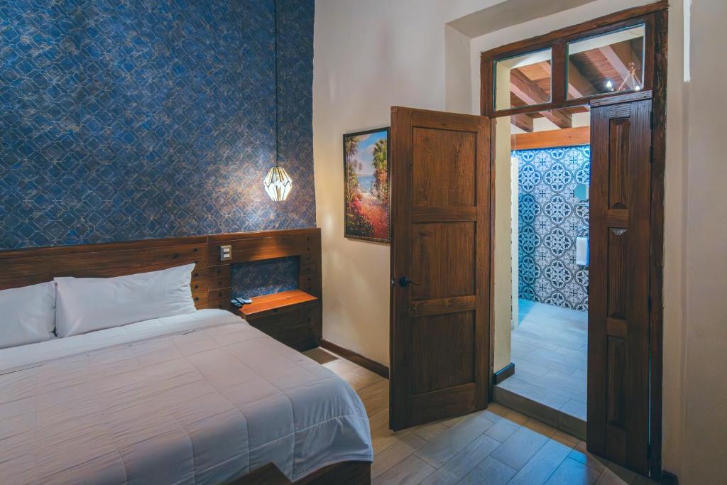 Postel nebo postele na pokoji v ubytování Hotel Boutique Casa Altamira