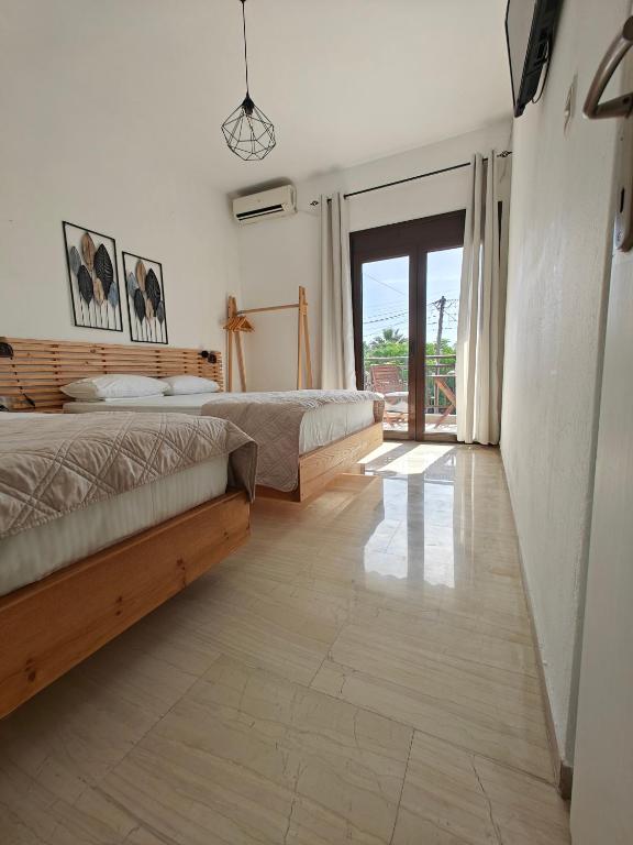 Postel nebo postele na pokoji v ubytování Anthoula House Sarti