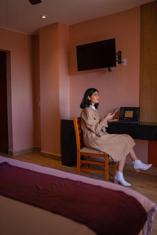 TV a/nebo společenská místnost v ubytování Hotel Suites Corazón Mexicano