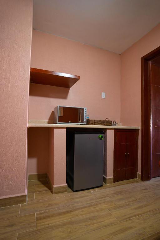 Kuchyň nebo kuchyňský kout v ubytování Hotel Suites Corazón Mexicano