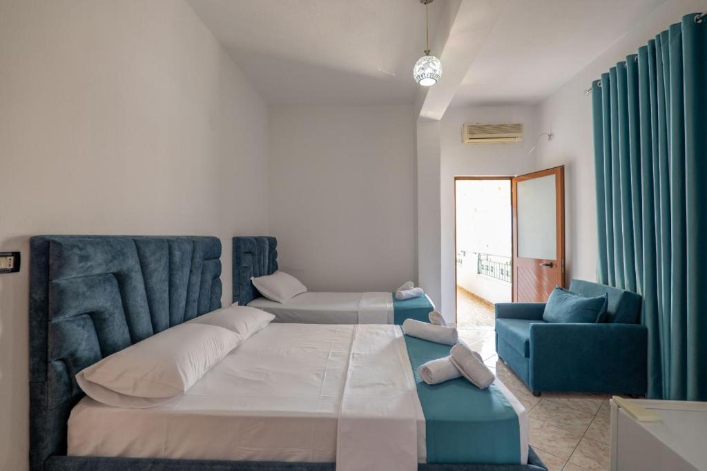 Postel nebo postele na pokoji v ubytování Hotel Vila Vilson