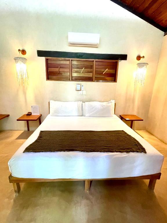 Postel nebo postele na pokoji v ubytování Hotel Buenavista Bacalar Jungle Experience