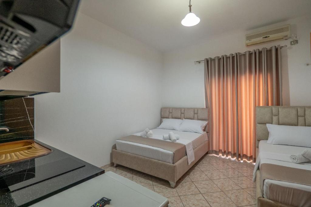 Postel nebo postele na pokoji v ubytování Hotel Vila Vilson