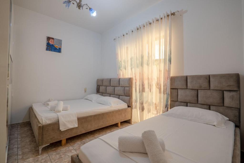 Postel nebo postele na pokoji v ubytování Hotel Vila Vilson