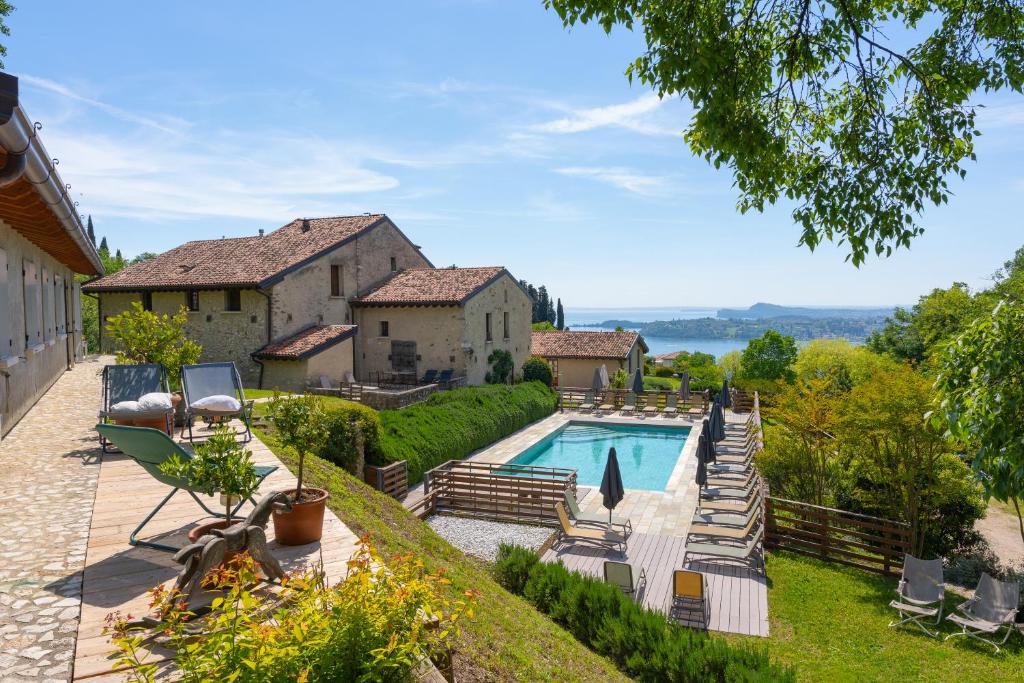 an estate with a swimming pool and a house at Premignaga Natural Home in Gardone Riviera