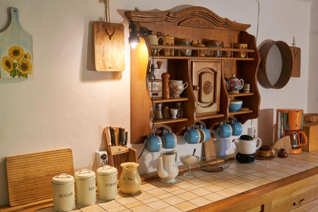 a counter with a bunch of ceramics on it at Bieszczadzka Samotnia in Cisna