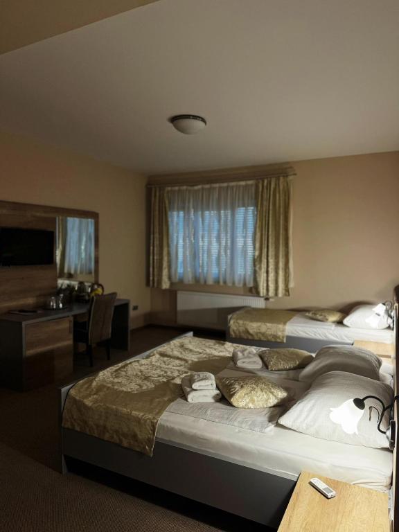 Postel nebo postele na pokoji v ubytování Rooms Comfor