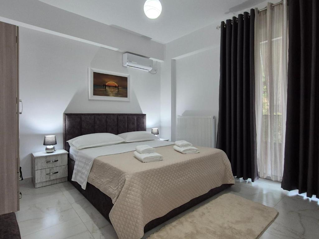 Ένα ή περισσότερα κρεβάτια σε δωμάτιο στο FLORE Rooms