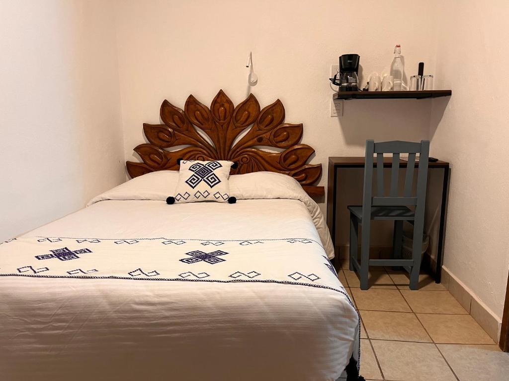 Postel nebo postele na pokoji v ubytování Hotel Ocho Barrios