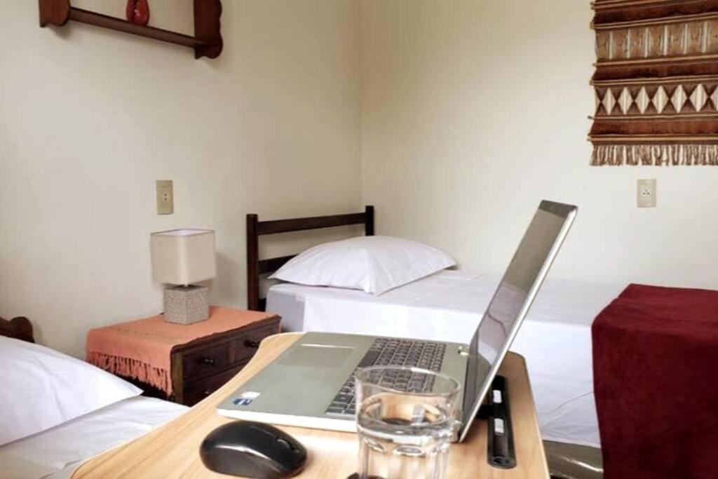 Postel nebo postele na pokoji v ubytování CASA DA PRAÇA Ibicoara - a melhor hospedagem