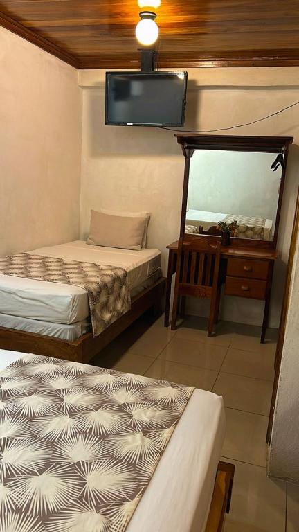Postel nebo postele na pokoji v ubytování Hotel Javy