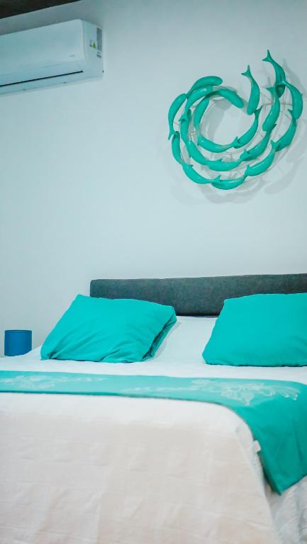 Postel nebo postele na pokoji v ubytování Pension Irivai, appartement UO UO 3 chambres vue mer
