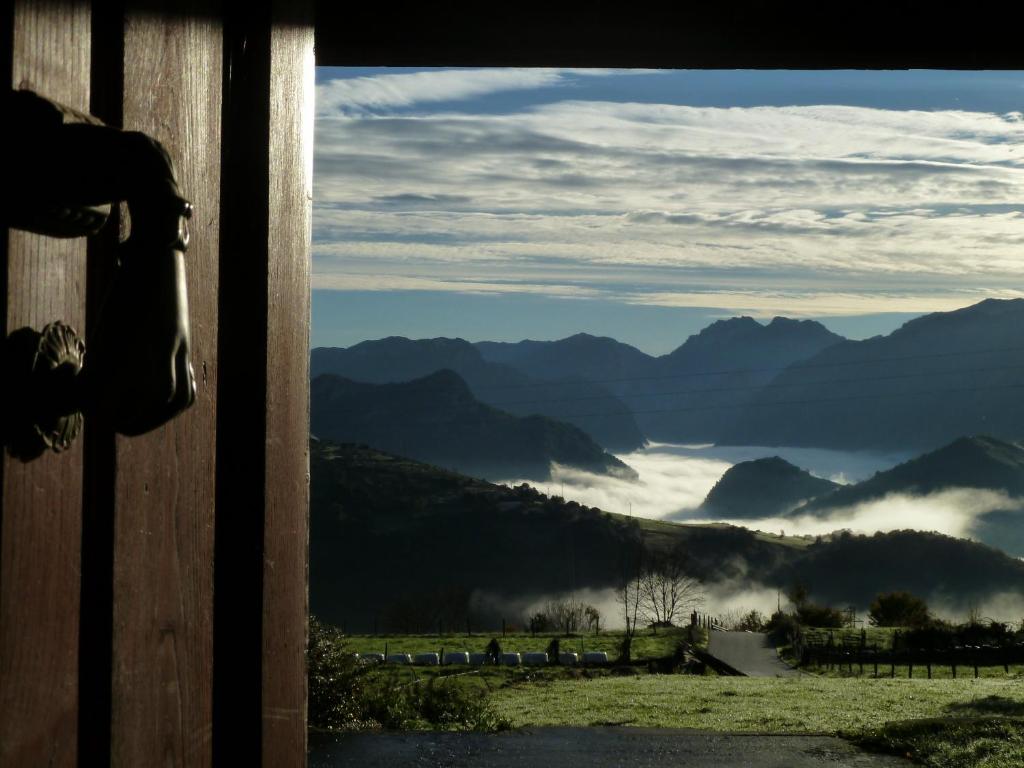 a view from a door of a mountain view at Casa Rural La Cortina in Pandiello