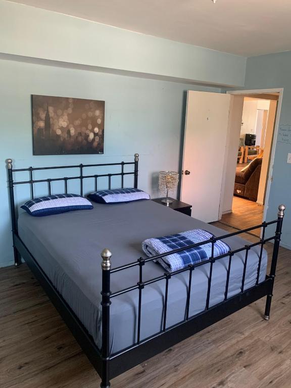 a bed with two pillows on it in a room at LA Love Home in Los Angeles