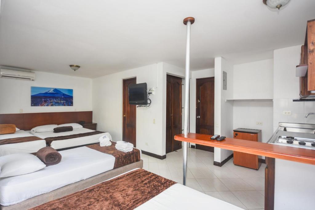 Postel nebo postele na pokoji v ubytování Hotel Estadio Real