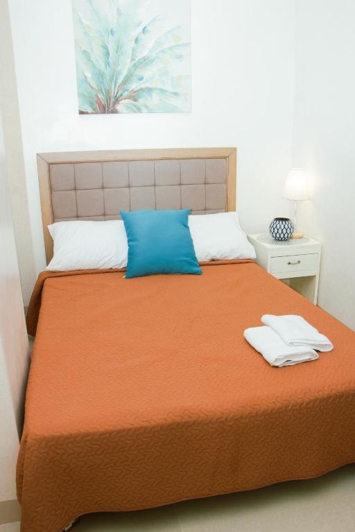 Postel nebo postele na pokoji v ubytování Amar Residence