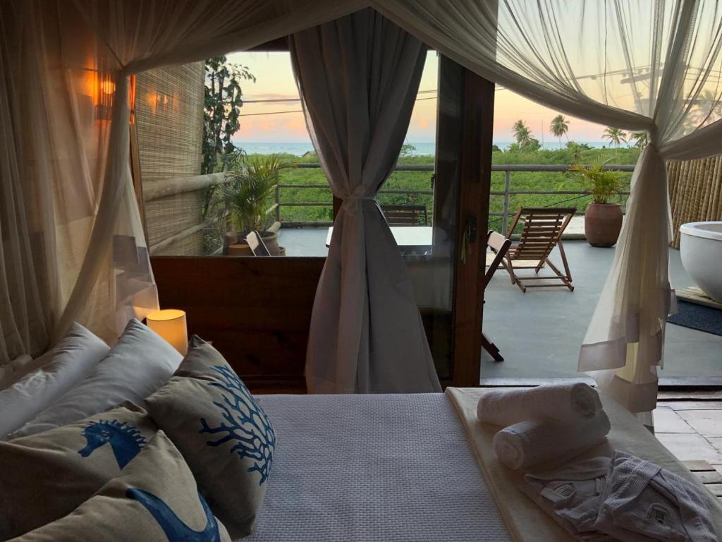 Postel nebo postele na pokoji v ubytování Casa Ocean Trancoso
