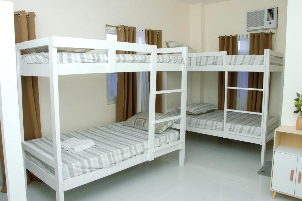 Postel nebo postele na pokoji v ubytování Amar Residence