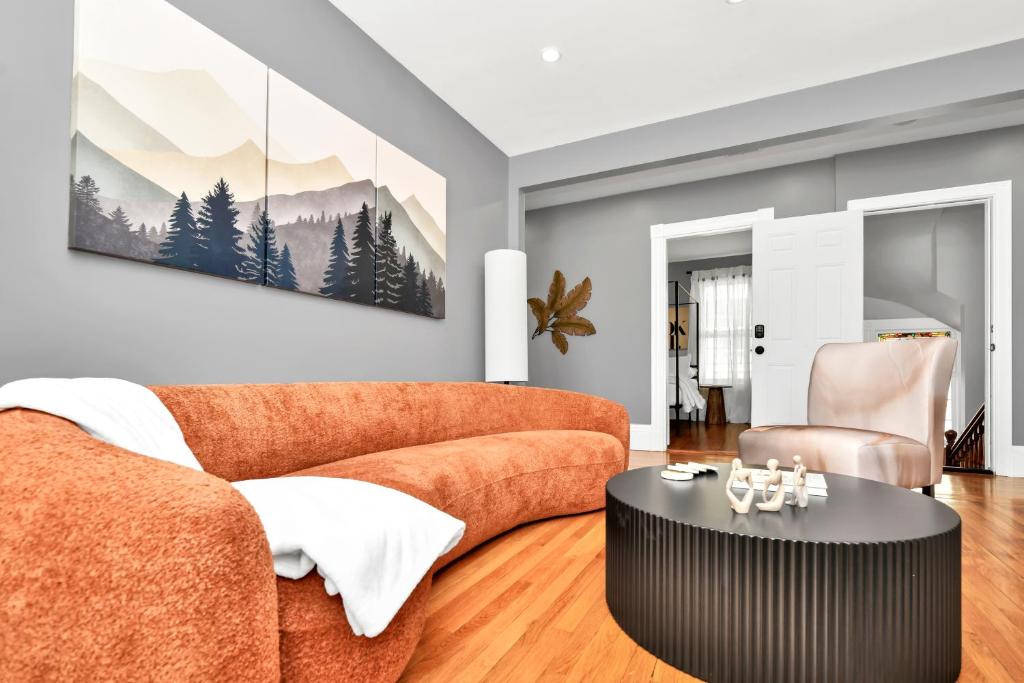 a living room with a couch and a table at Comfort Stay in Boston