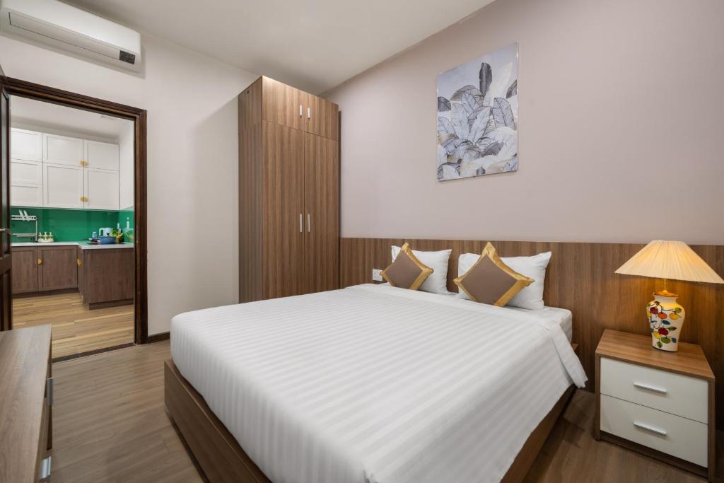 Postel nebo postele na pokoji v ubytování ATP Galaxy Hotel & Apartment Danang