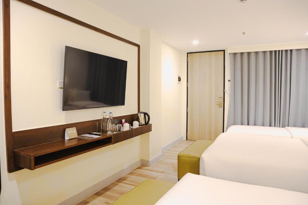 Postel nebo postele na pokoji v ubytování Mandarin Nest Boracay