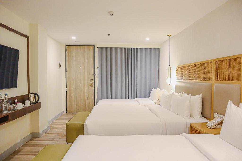 Postel nebo postele na pokoji v ubytování Mandarin Nest Boracay