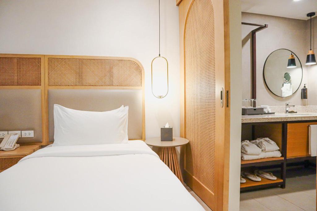 Postel nebo postele na pokoji v ubytování Mandarin Nest Boracay