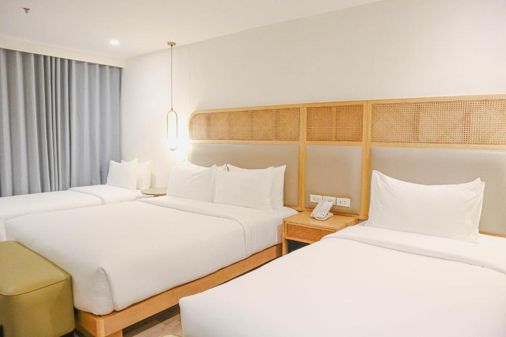 Postel nebo postele na pokoji v ubytování Mandarin Nest Boracay