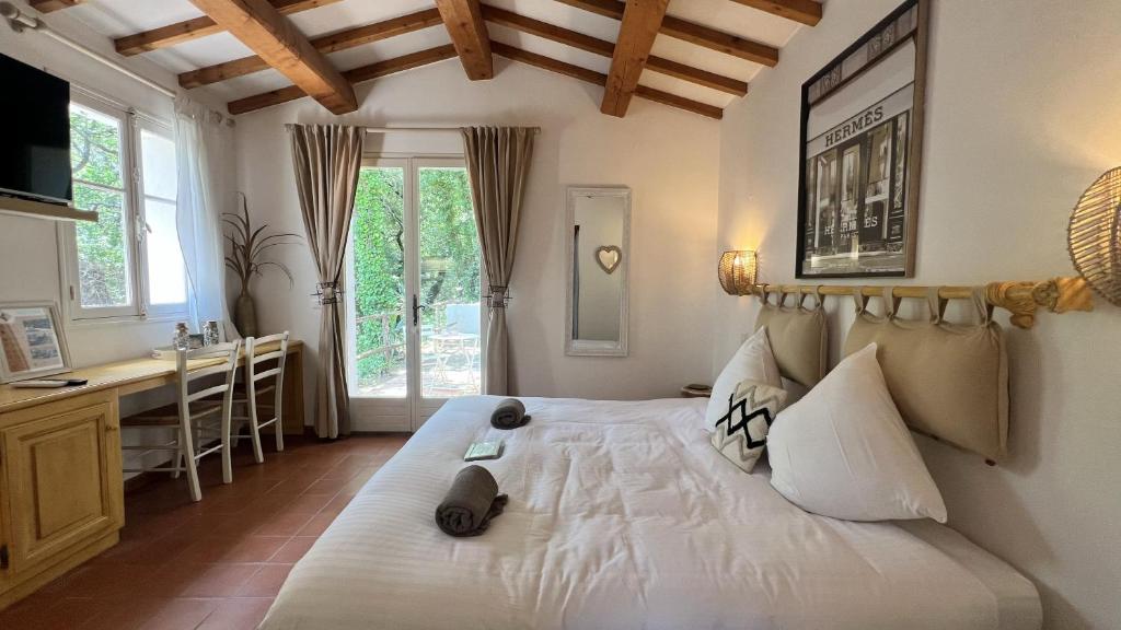 Posteľ alebo postele v izbe v ubytovaní B&B Maison Gigi