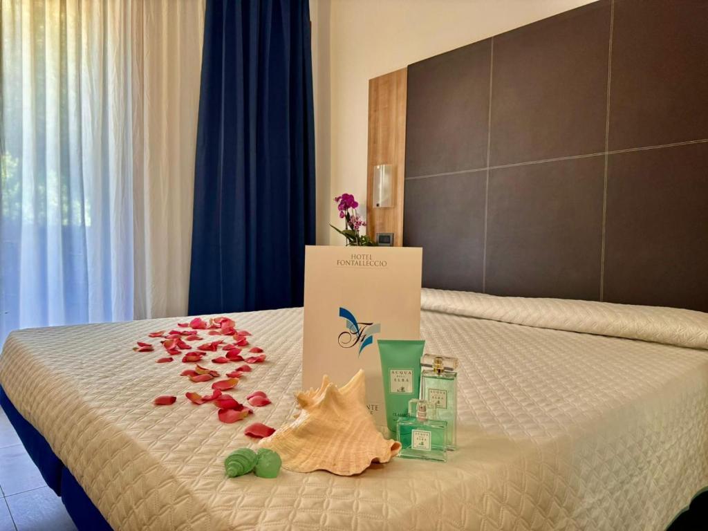 Postel nebo postele na pokoji v ubytování Hotel Fontalleccio