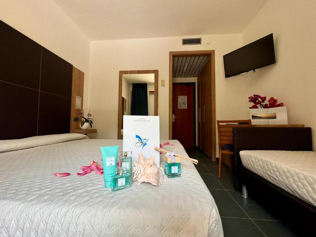 Postel nebo postele na pokoji v ubytování Hotel Fontalleccio