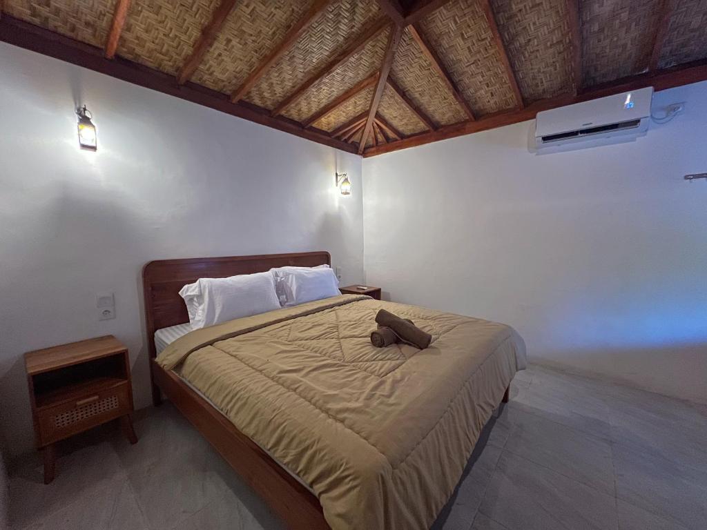 Postel nebo postele na pokoji v ubytování Bae Gili Inn