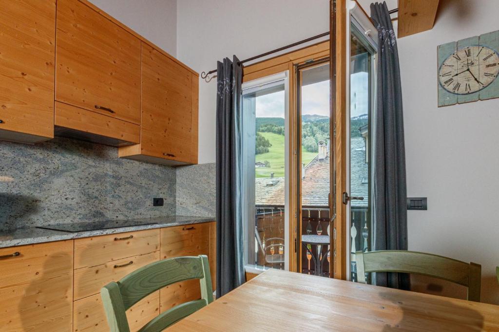 Kuchyň nebo kuchyňský kout v ubytování Chalet Silvi Residence