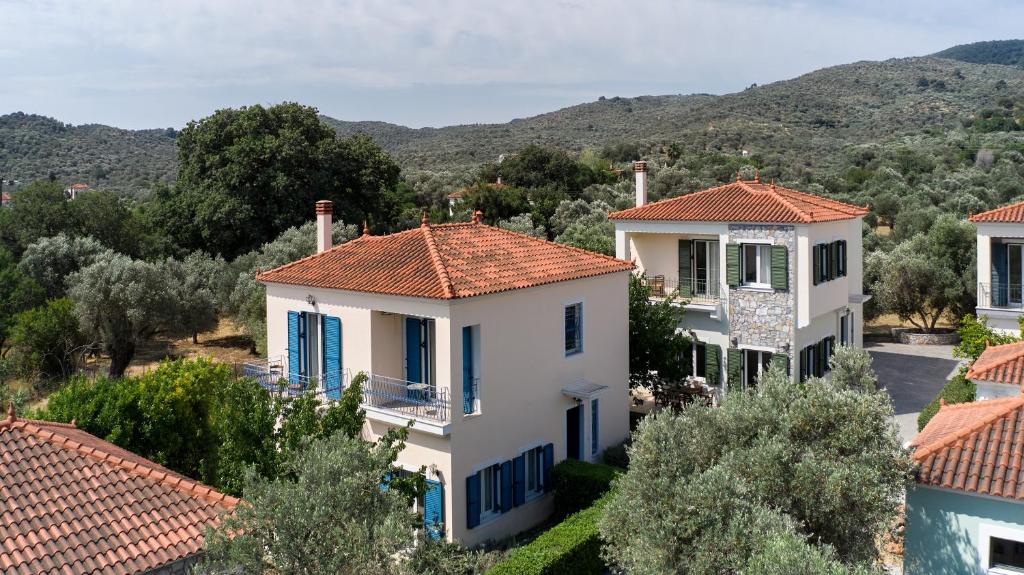 a view of a house with red tile roofs at Art Lesvos Villa 3 in Pyrgi Thermis