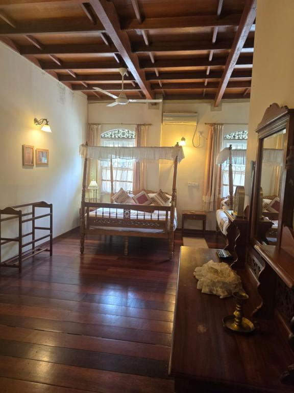 Postel nebo postele na pokoji v ubytování Manor House-Kandy
