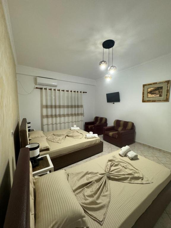 Llit o llits en una habitació de Hotel Frida