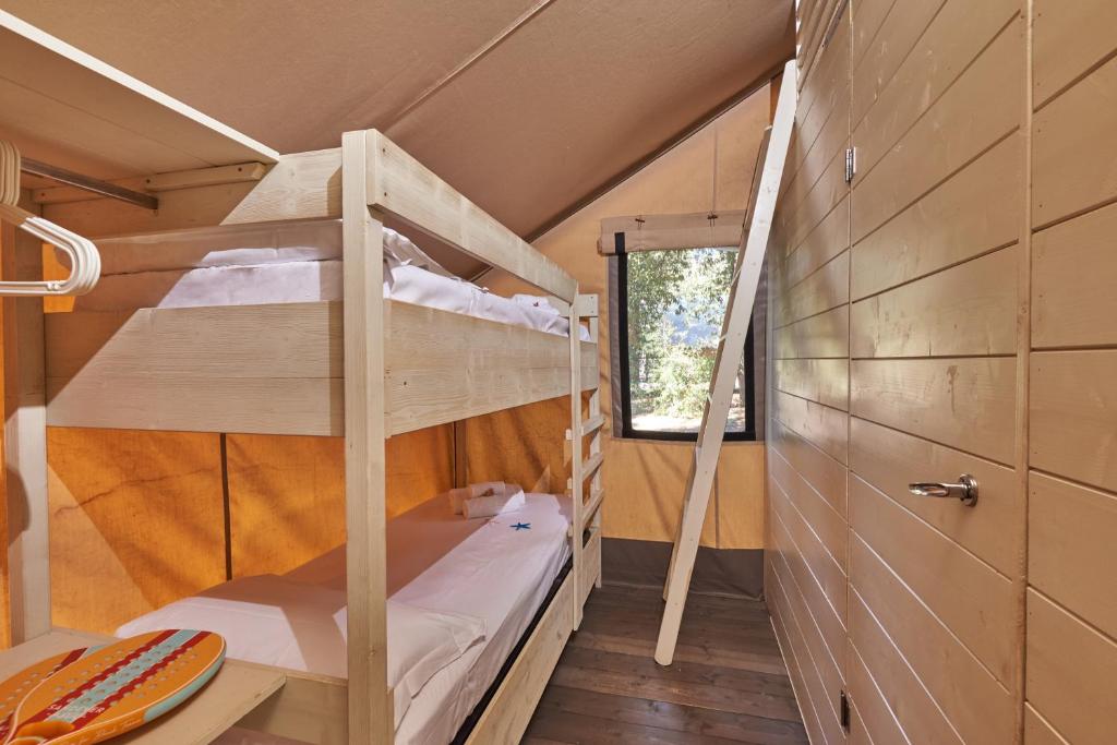 Postel nebo postele na pokoji v ubytování Paradù EcoVillage & Resort