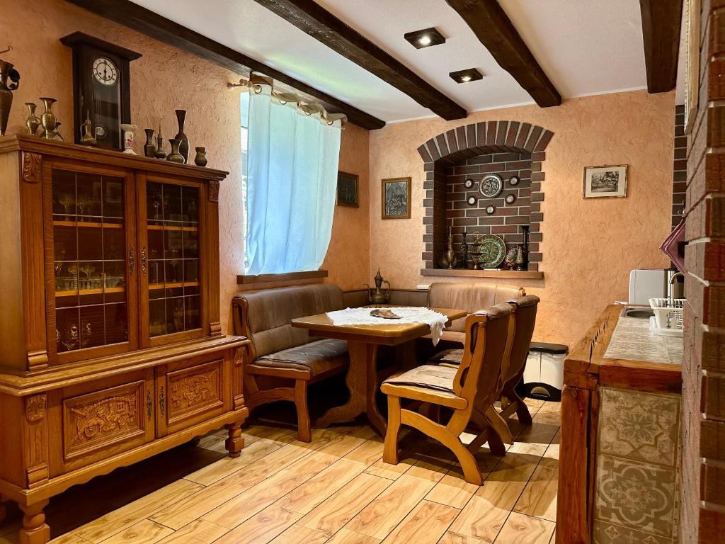 a kitchen with a table and chairs and a dining room at Ganze Unterkunft nur für EUCH! in Rabenau