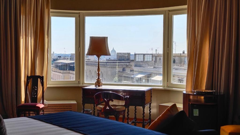 Postel nebo postele na pokoji v ubytování Triviho Hotel