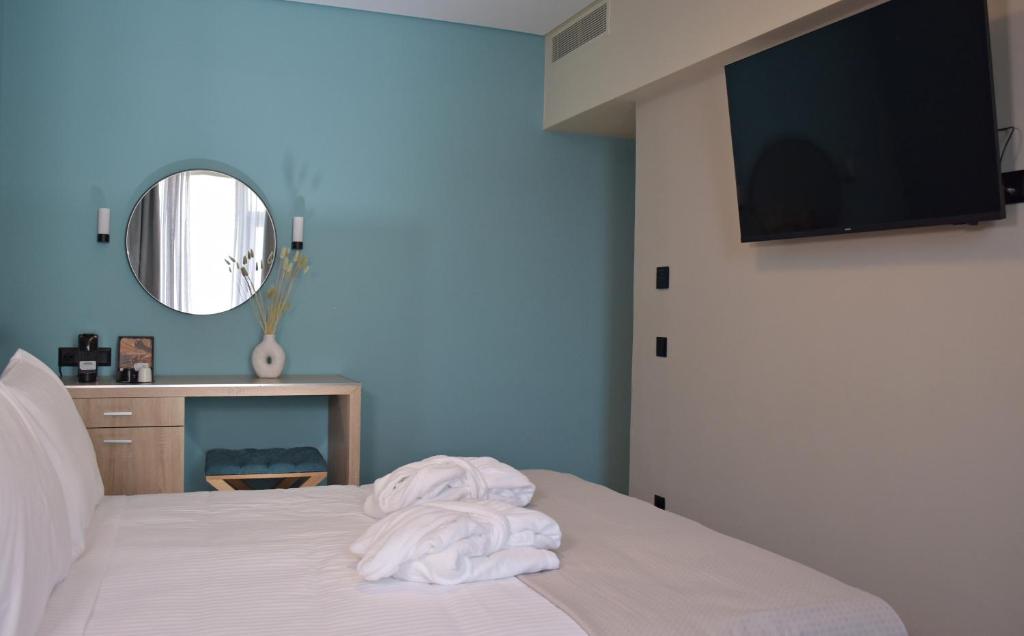 Posteľ alebo postele v izbe v ubytovaní Arethusa Hotel Athens