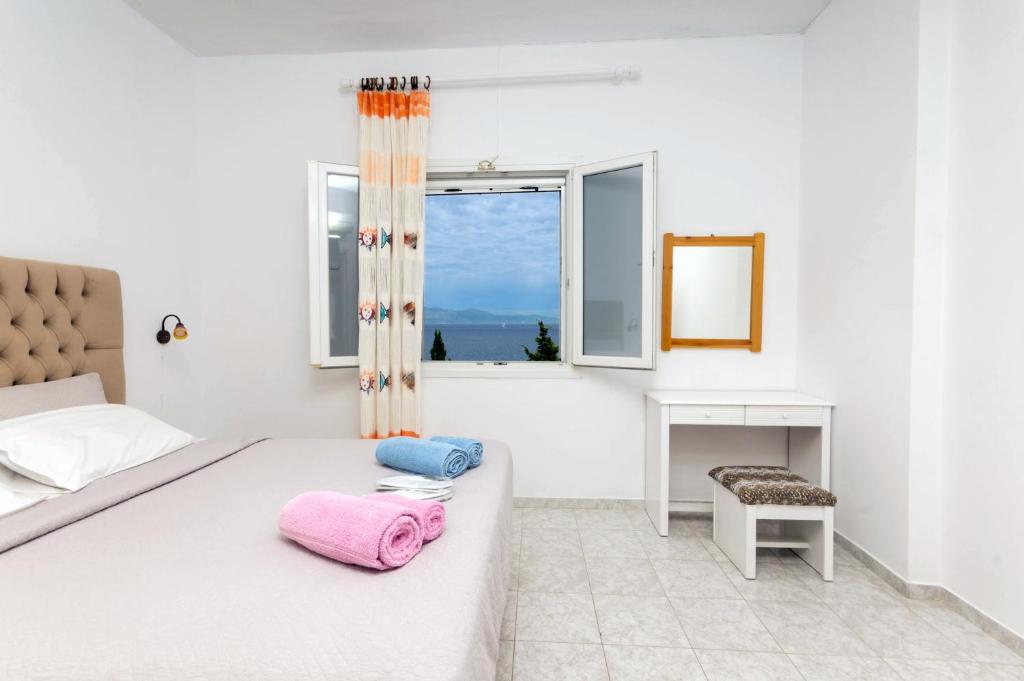 Postel nebo postele na pokoji v ubytování Villa Baronnos