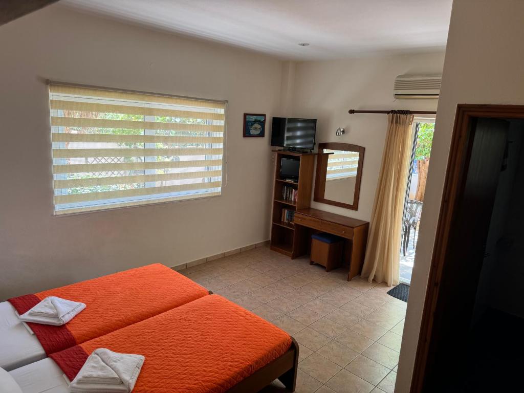 Ένα ή περισσότερα κρεβάτια σε δωμάτιο στο Michalis studios