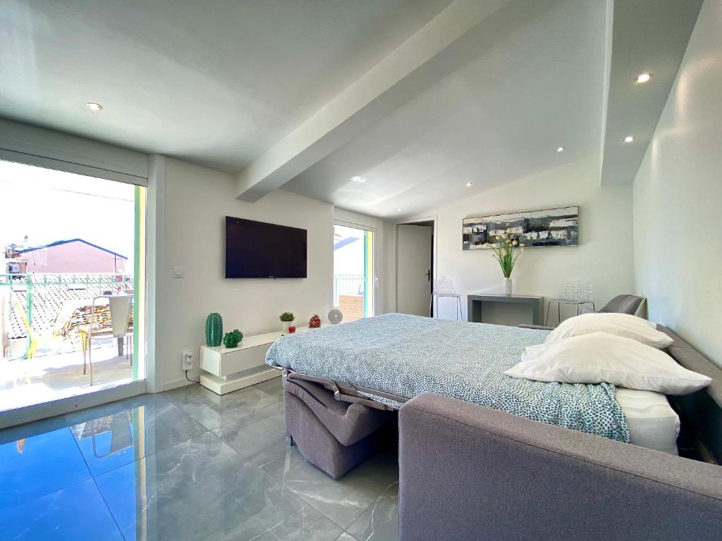 Televízia a/alebo spoločenská miestnosť v ubytovaní Duplex Luxury Toîts du Soleil By SCLS Locations