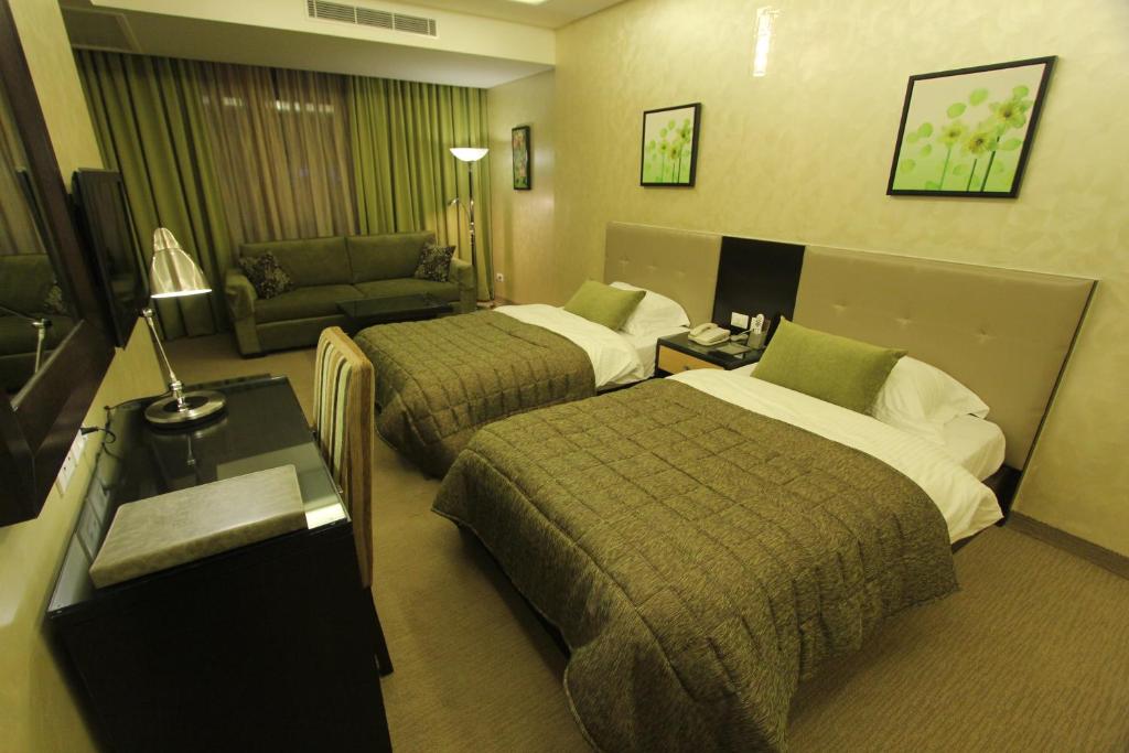 Postel nebo postele na pokoji v ubytování Elite Hotel By Beverly