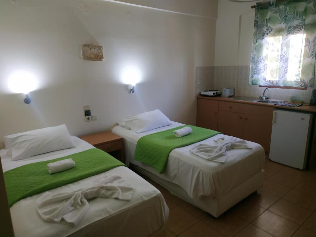 Postel nebo postele na pokoji v ubytování Lia Sofia Apartments