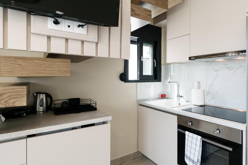 Kuchyň nebo kuchyňský kout v ubytování Mulberry Suites