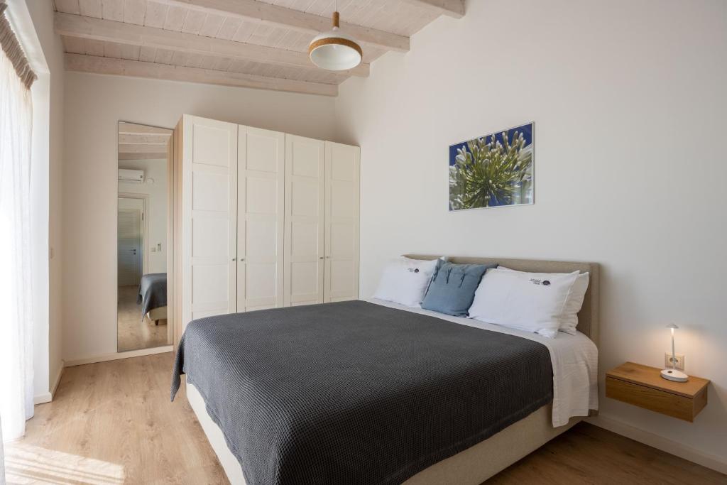 Łóżko lub łóżka w pokoju w obiekcie Alfresco Villas