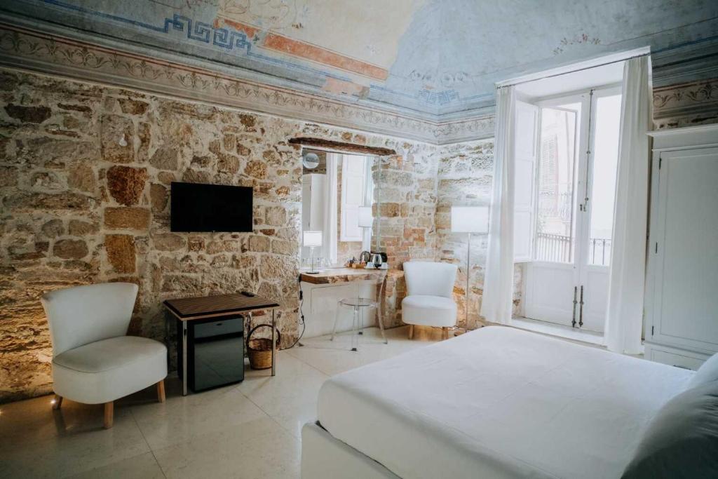 Postel nebo postele na pokoji v ubytování Ambrosia-Timeless Hosting