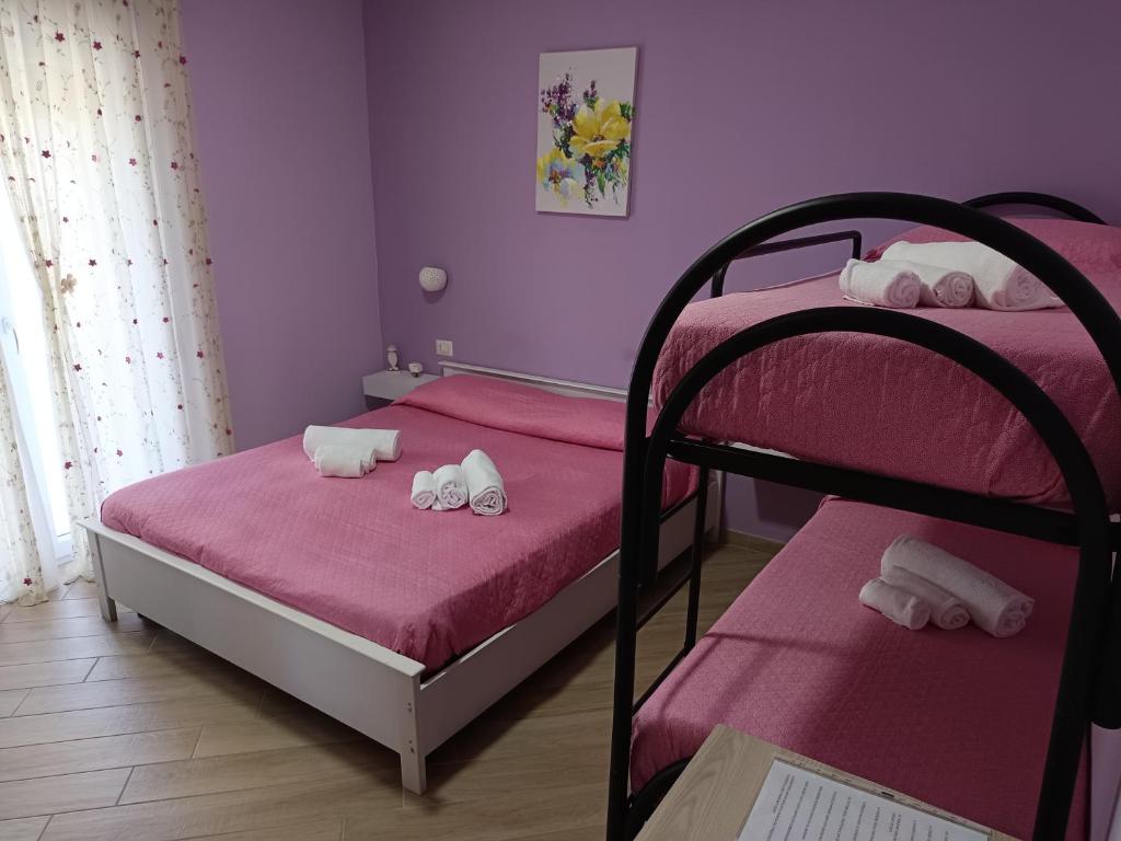 Postel nebo postele na pokoji v ubytování B&B Il Gioiello