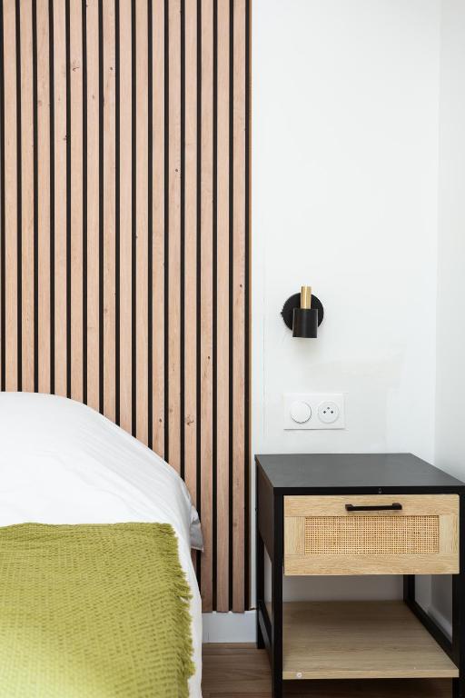 Postel nebo postele na pokoji v ubytování Maison Geranium